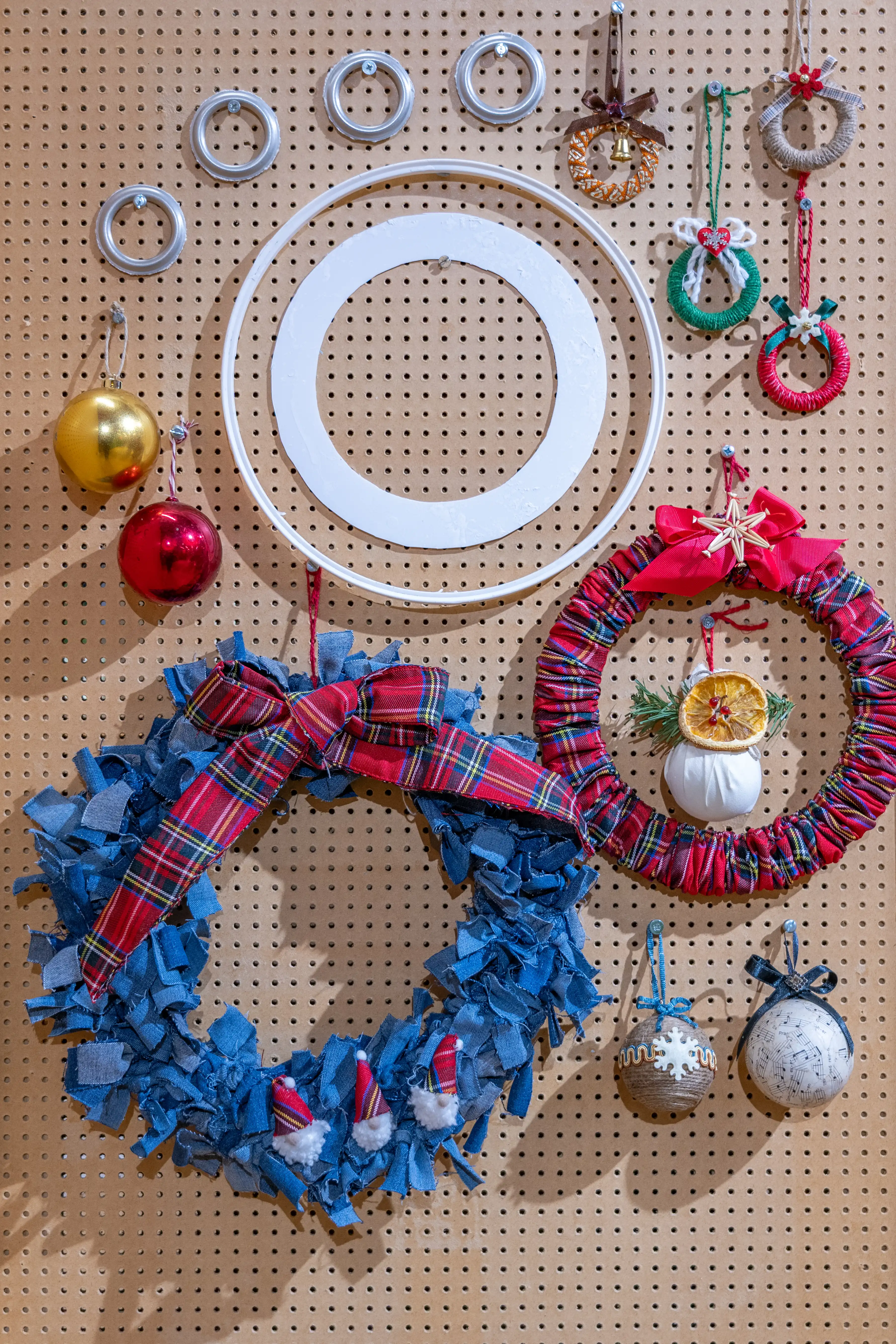 Homemade Christmas Decorations - Multiple decorations hanging on a wall - Hoops, baubles etc.