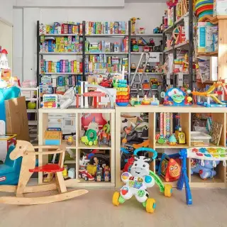 A toy repair shop, with lots of toys stacked neatly in a display